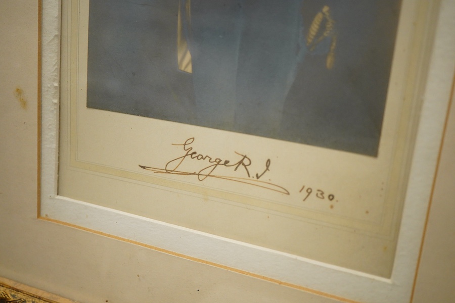 A pair of framed photographs of King George V and Queen Mary, signed by each on the Mount beneath the photograph, and both dated 1930, contained within a gilt frame, overall dimensions 50.5 x 61cm